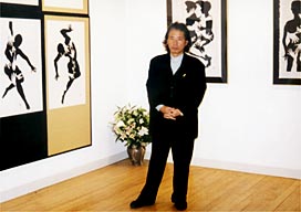 Okamura in front of his works
